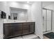 Bathroom featuring dual sinks, quartz countertop, and a glass enclosed walk-in shower at 6507 W Whispering Way, Greenfield, IN 46140