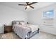 Comfortable bedroom with a large window, soft carpet, and a stylish bedframe at 6507 W Whispering Way, Greenfield, IN 46140
