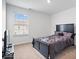 Cozy bedroom featuring a large window and sleek furniture, creating a modern and inviting space at 6507 W Whispering Way, Greenfield, IN 46140