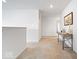 Hallway with carpeted floors, natural light, and a console table at 6507 W Whispering Way, Greenfield, IN 46140