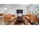 Bright living room with stylish furniture, hardwood floors, and a large tv at 6507 W Whispering Way, Greenfield, IN 46140