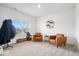 Cozy sitting room with natural light, stylish seating, and modern decor at 6507 W Whispering Way, Greenfield, IN 46140