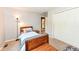 Comfortable bedroom with a twin bed, a floor lamp, and a view to an adjacent room at 6580 Kings Ct, Avon, IN 46123