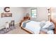 Nicely decorated bedroom featuring a cozy bed, wooden furniture, and natural light from the window at 6580 Kings Ct, Avon, IN 46123