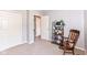Well-lit bedroom featuring a rocking chair, and multiple doorways providing easy access to other rooms at 6580 Kings Ct, Avon, IN 46123