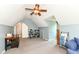 Finished attic bonus room with natural light, neutral carpet, and fan at 6580 Kings Ct, Avon, IN 46123