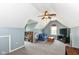 Finished bonus room with natural light, neutral carpet, and fan at 6580 Kings Ct, Avon, IN 46123