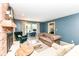 Cozy living room features a brick fireplace, plush seating, and a built-in desk area at 6580 Kings Ct, Avon, IN 46123