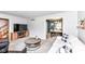 Relaxing living room with a white couch, rounded coffee table, media center and an entry to the dining room at 6580 Kings Ct, Avon, IN 46123