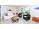 Bright and airy living room with a sofa, chairs, and an abundance of natural light, ideal for relaxation at 6580 Kings Ct, Avon, IN 46123