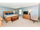Relaxing primary bedroom featuring a wooden bed set, natural light, and neutral paint at 6580 Kings Ct, Avon, IN 46123
