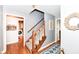 Inviting entry featuring a staircase with wood railing, leading to the upper level of the home at 6580 Kings Ct, Avon, IN 46123