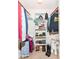 Well-organized walk-in closet with shelving, hanging rods and ample storage space for clothing and shoes at 6580 Kings Ct, Avon, IN 46123