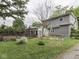 View of backyard, deck, and fenced area behind home at 70 Fairground St, Franklin, IN 46131