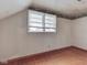 Bedroom with hardwood flooring and a window providing natural light at 70 Fairground St, Franklin, IN 46131