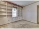 Bright room showcases built-in cabinets, carpet, and a large window at 70 Fairground St, Franklin, IN 46131