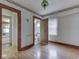 Bedroom with hardwood floors and view into bath and other rooms at 70 Fairground St, Franklin, IN 46131