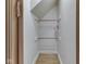 Hall closet with wooden rods for hanging clothes at 70 Fairground St, Franklin, IN 46131