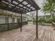 Wooden deck with overhead pergola in backyard at 70 Fairground St, Franklin, IN 46131
