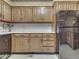 Kitchen features oak cabinets and black appliances at 70 Fairground St, Franklin, IN 46131