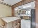 Bright kitchen features oak cabinets, island, and black appliances at 70 Fairground St, Franklin, IN 46131