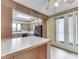 Open kitchen featuring wood cabinets, appliances, and an island with counterspace at 70 Fairground St, Franklin, IN 46131