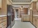 Kitchen with oak cabinets and black refrigerator at 70 Fairground St, Franklin, IN 46131