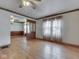 Open living room with hardwood floors, a ceiling fan, and a dividing screen at 70 Fairground St, Franklin, IN 46131