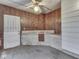 Outdoor patio features fan, white door, and stone sink at 70 Fairground St, Franklin, IN 46131