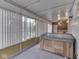 Bright sunroom features hot tub, windows, and fan at 70 Fairground St, Franklin, IN 46131