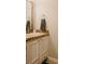 Bathroom vanity featuring mosaic tile trim, providing a clean and stylish space at 7402 Northfield Blvd, Fishers, IN 46038