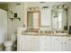 Spacious bathroom with double vanity, mosaic tile, and ample lighting at 7402 Northfield Blvd, Fishers, IN 46038