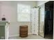 Bathroom with storage cabinet, laundry basket, and mirror closet, offering functionality and style at 7402 Northfield Blvd, Fishers, IN 46038