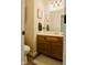 Well-lit bathroom features a double vanity, framed decor, and a neutral color palette at 7402 Northfield Blvd, Fishers, IN 46038