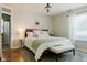 Bedroom with a plush rug, bench, and bright natural light, creating a relaxing atmosphere at 7402 Northfield Blvd, Fishers, IN 46038
