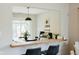 Casual breakfast bar overlooking a dining area, creating a great entertaining space at 7402 Northfield Blvd, Fishers, IN 46038