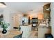 Well-lit kitchen featuring stainless steel appliances, a center island, and ample counter space for meal preparation at 7402 Northfield Blvd, Fishers, IN 46038