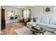 Open-concept living area with a breakfast bar, comfortable seating, and natural light at 7402 Northfield Blvd, Fishers, IN 46038