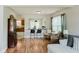 Spacious living room with wood floors, wicker furniture, and stylish decor at 7402 Northfield Blvd, Fishers, IN 46038