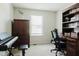 Functional office space with built-in shelving, desk, and natural light, ideal for productivity at 7402 Northfield Blvd, Fishers, IN 46038
