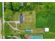 Top-down view of a home with an outbuilding, green lawns, and surrounding farmland at 7447 S 25 E, Pendleton, IN 46064