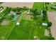 Aerial view of farm, buildings, and fields, showcasing the expansive property at 7447 S 25 E, Pendleton, IN 46064