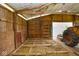 A wooden barn interior featuring a hay-covered floor and exposed beams at 7447 S 25 E, Pendleton, IN 46064