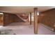 Spacious basement area with wood paneling and stairs leading to another level at 7447 S 25 E, Pendleton, IN 46064