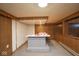 Basement view, showcasing a retro-style bar area with a unique red and white countertop at 7447 S 25 E, Pendleton, IN 46064