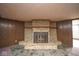 View of the basement fireplace with stone surround and hearth at 7447 S 25 E, Pendleton, IN 46064
