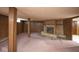 Basement features a fireplace, wood paneled walls, and carpeted floors at 7447 S 25 E, Pendleton, IN 46064