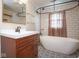 Bathroom features black hardware, decorative tile flooring, and white subway tile at 7447 S 25 E, Pendleton, IN 46064
