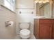 Compact bathroom featuring a toilet, vanity with storage, and a walk-in shower at 7447 S 25 E, Pendleton, IN 46064