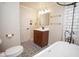Bathroom boasts black hardware, decorative tile flooring, and white subway tile at 7447 S 25 E, Pendleton, IN 46064